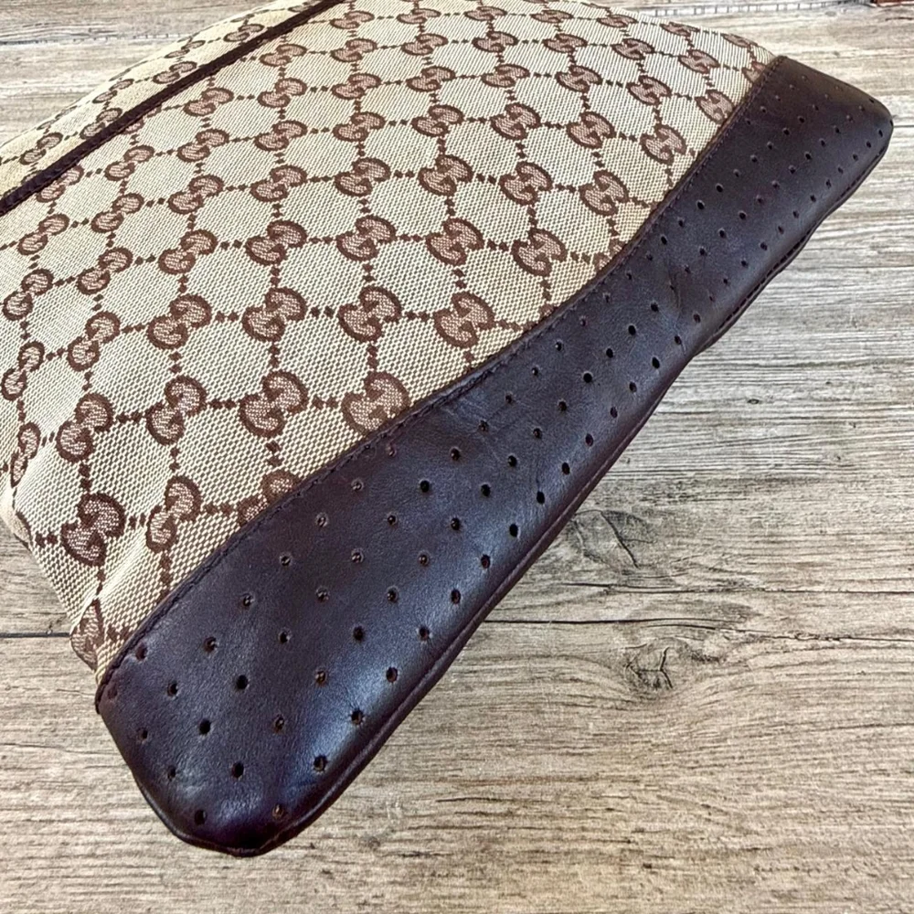 Gucci GG Monogram perforated leather messenger bag